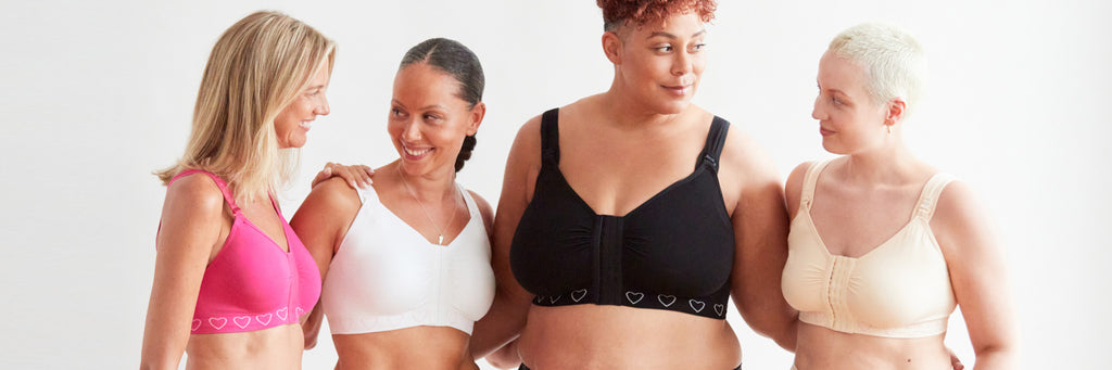 Four women wearing the Cancer Research UK post-surgery bra in different colours.