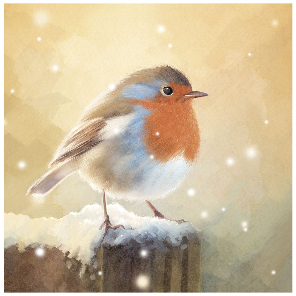 A Christmas card of a European robin with a red-orange breast perched on a snow-covered wooden post. The background is softly blurred with warm tones and gently falling snowflakes.