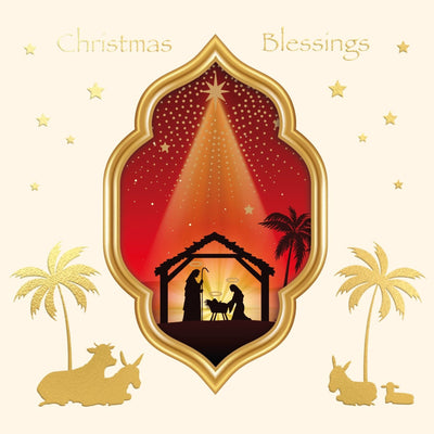 A religious Christmas card featuring a golden ornate frame with a nativity scene silhouette, red and gold sky, stars, palm trees, and gold silhouettes of animals on a cream background.