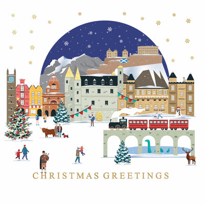 A charity Christmas card featuring a festive illustrated Edinburgh scene with snow-covered mountains, historic buildings, a Christmas tree, a red passenger train on a bridge, small people walking and playing, and the text 'CHRISTMAS GREETINGS' at the bottom on a white background.