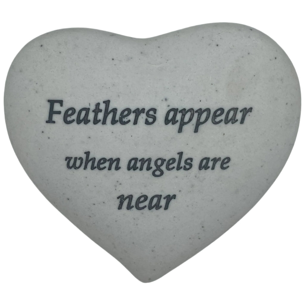 Remembrance stone with the words "Feathers appear when angels are near"