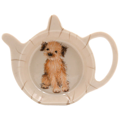 A sand coloured ceramic teabag tidy featuring a sweet design of a Border Terrier.