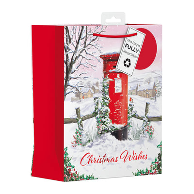 Christmas gift bag featuring a traditional red postbox surrounded by greenery, and snow. This is the medium variant. Gift bag is fully recyclable.