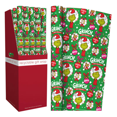 Grinch-themed recyclable gift wrap shown both rolled and flat, alongside a red display box. The wrapping paper features the Grinch, Santa hats, ornaments, and the word 'Grinch' on a bright green background.