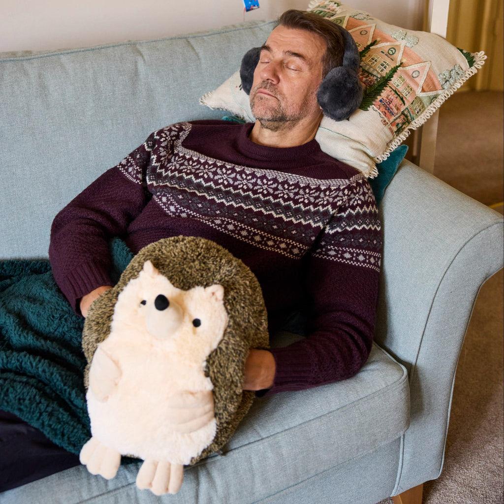 Extra large novelty hedgehog hand warmer. Perfect for gifting, simple slide your hands into the pouches and snuggle up.