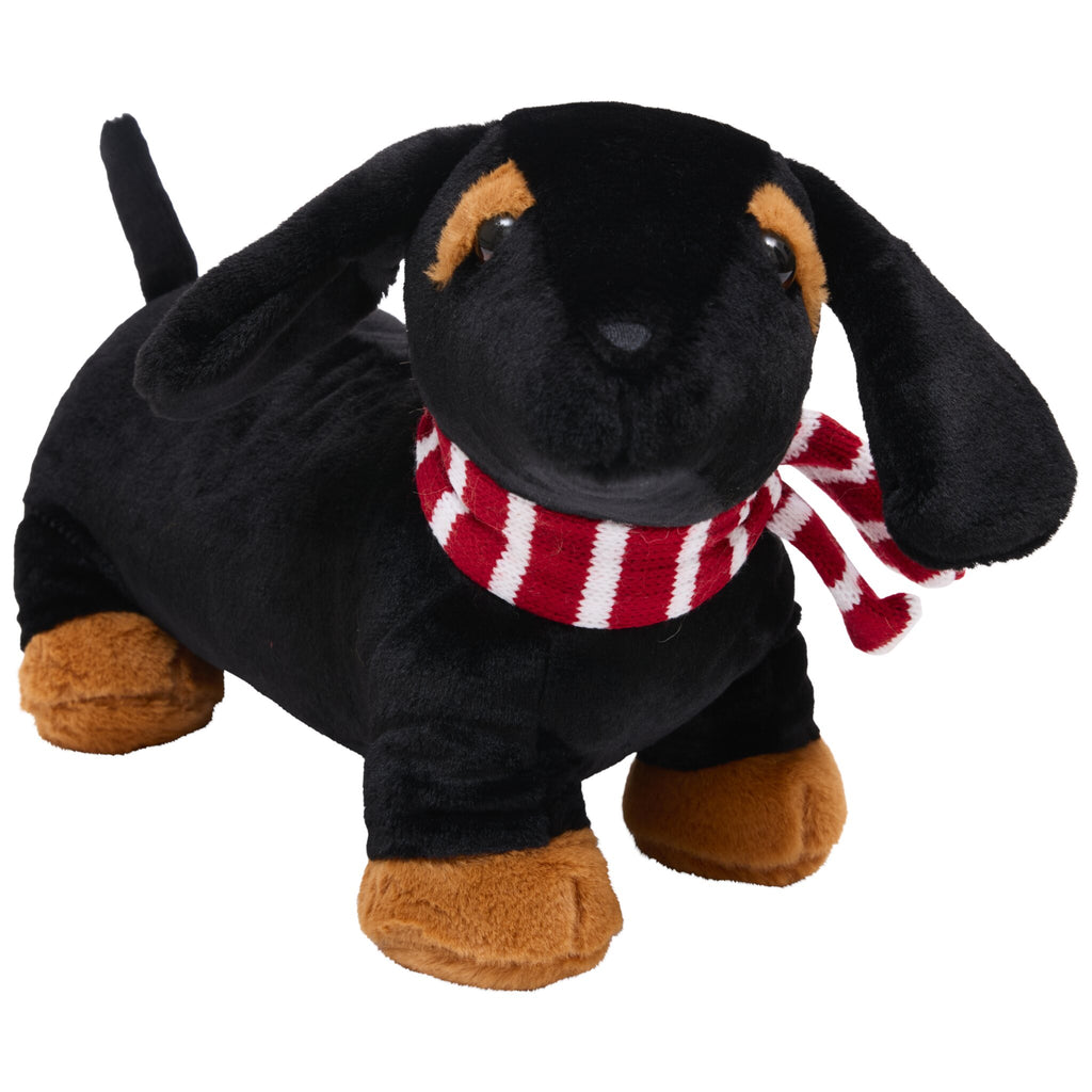 A smooth-coated doorstop shaped like a black dachshund with brown patches above its eyes and on its paws, wearing a red and white striped scarf around its neck.