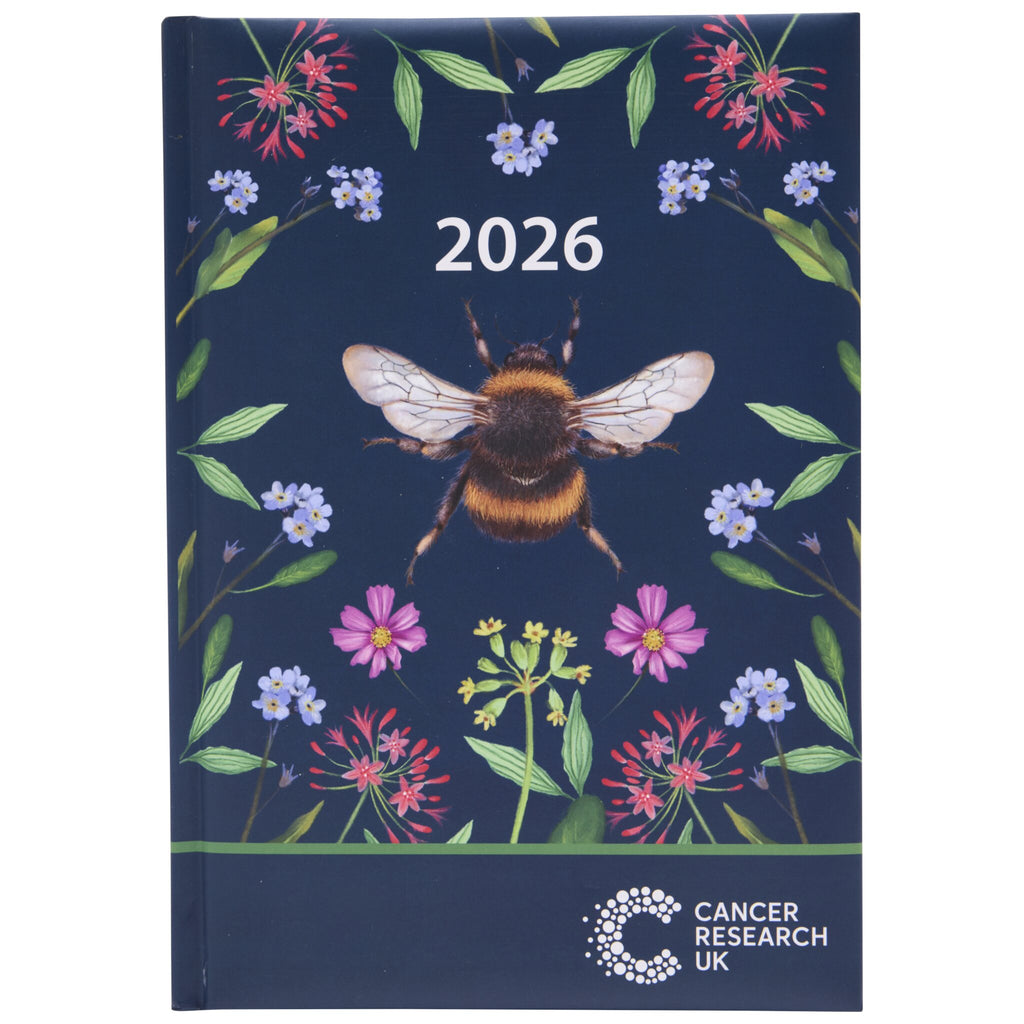 2026 desk diary with a bee and floral design on a dark blue background, featuring Cancer Research UK.