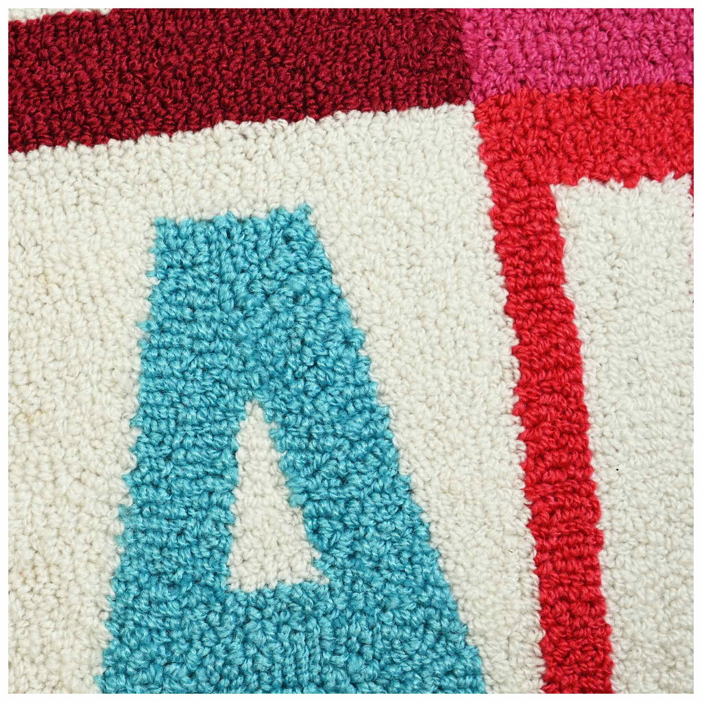 Up close of square Christmas cushion featuring FA LA LA LA design. A perfect piece of Christmas decor 