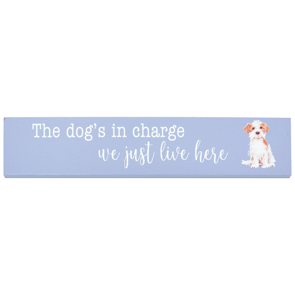 A light blue plaque, built for shelves and mantlepieces has the message "The dog's in charge, we just live here". A sweet Jack Russell Terrier design is sitting to the right of the message.