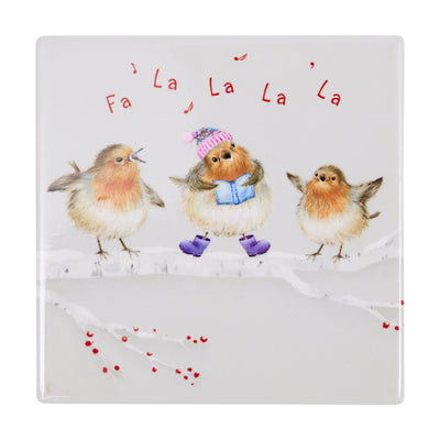 A square ceramic coaster featuring a winter illustration of three robins on a snowy branch. The robin in the centre wears a pink knit hat and blue boots, while the two robins on either side have orange-breasted feathers.
