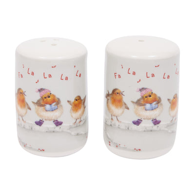 A pair of white ceramic salt and pepper shakers featuring painted robin illustrations in winter clothing and the word 'Fa La La La' in red script.