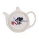 An off-white ceramic teapot-shaped teabag tidy featuring a printed illustration of a small black and white dog lying next to a red bauble, set against a plain white background.