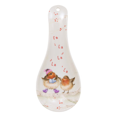 A white ceramic spoon rest featuring a festive winter illustration of two small robin birds and the words 'Fa La La La La La' in red script.
