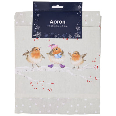 A light beige baking apron with a winter robin design, featuring three robins on a snowy branch with red berries and white polka dots. It has a dark navy blue cardboard hanger at the top labelled 'Apron with adjustable neck strap'.