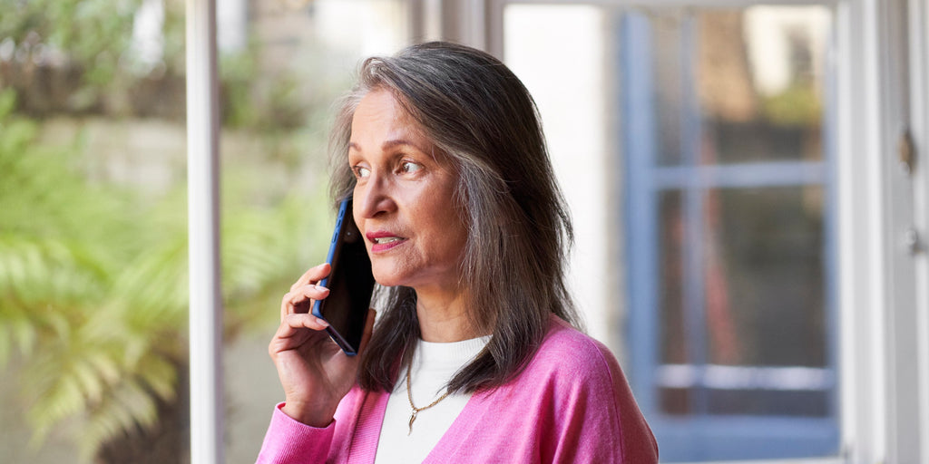 Women speaks to a cancer nurse on the phone