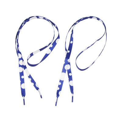 A pair of blue 100cm trainer laces with large white polka dots, laid out flat against a white background, showing the full length and pattern of the sports accessory.