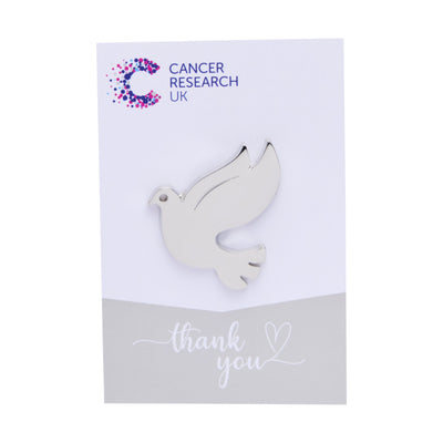 Silver dove wedding favour on a backing card featuring the Cancer Research UK logo and a thank-you message.