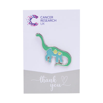 Green  brachiosaurus wedding favour on a backing card featuring the Cancer Research UK logo and a thank-you message.