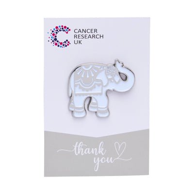 Silver elephant wedding favour on a backing card featuring the Cancer Research UK logo and a thank-you message.