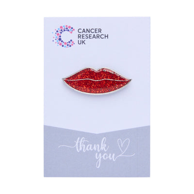 Glittery lips wedding favour on a backing card featuring the Cancer Research UK logo and a thank-you message.