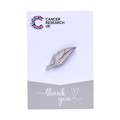 Silver feather wedding favour on a backing card featuring the Cancer Research UK logo and a thank-you message.