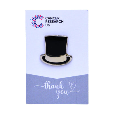 Black top hat wedding favour on a backing card featuring the Cancer Research UK logo and a thank-you message.