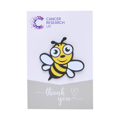 Cartoon bumblebee wedding favour on a backing card featuring the Cancer Research UK logo and a thank-you message.